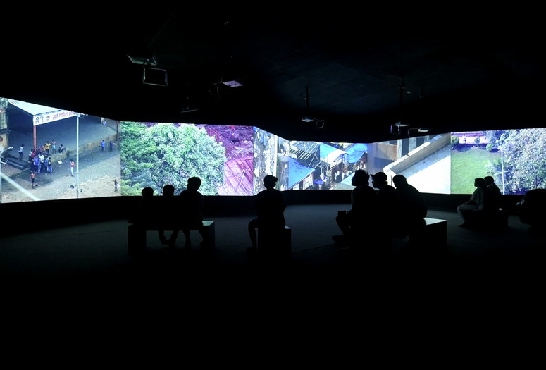 CAMP. Bombay Tilts Down. 2022. Loop, 6+1 screen environment from single-point CCTV video, 13 min. Installation view, Kochi-Muziris Biennale. Image courtesy the artists