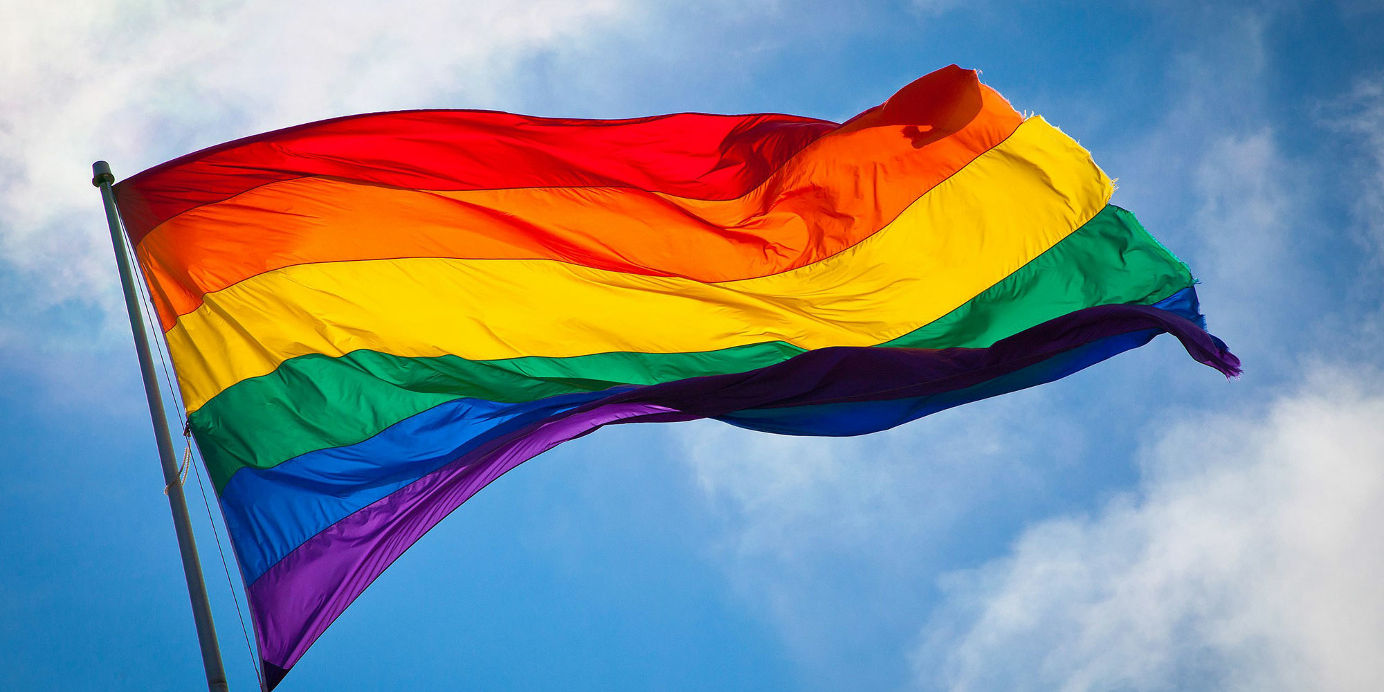 The Rainbow Flag waving in the wind at San Francisco’s Castro District. Photo: Benson Kua. Image used through Creative Commons Attribution-ShareAlike 2.0 Generic