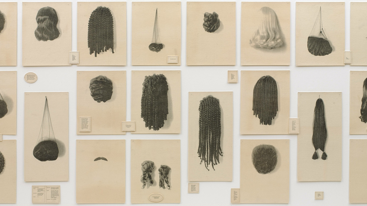Lorna Simpson. Wigs. 1994. Set of twenty-one lithographs and seventeen lithographed texts on felt, overall: 6&#39; x 13&#39; 6&#34; (182.9 x 411.5 cm). Rhona Hoffman Gallery, Chicago. 21 Steps, Albuquerque. Purchased with funds given by Agnes Gund, Howard B. Johnson, and Emily Fisher Landau. © 2023 Lorna Simpson.