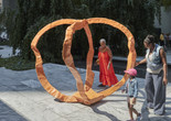 Photo: Franz West. Untitled (Orange). 2006. Polyester. The Museum of Modern Art, New York. Scott Burton Fund. © 2023 Estate of Franz West. Photo: Gus Powell Image description: A family in the Sculpture Garden observes the work titled Untitled (Orange) by Franz West.