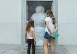 Photo: Peter Fischli and David Weiss. Snowman. 1987/2016. Copper, aluminum, glass, water, and coolant system. The Museum of Modern Art, New York. The Riklis Collection of McCrory Corporation (by exchange), and Committee on Painting and Sculpture Funds. © Peter Fischli and David Weiss. Photo: Gus Powell Image description: A family in the Sculpture Garden observes the work titled Snowman by Peter Fischli and David Weis.
