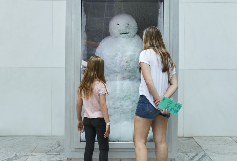 Photo: Peter Fischli and David Weiss. Snowman. 1987/2016. Copper, aluminum, glass, water, and coolant system. The Museum of Modern Art, New York. The Riklis Collection of McCrory Corporation (by exchange), and Committee on Painting and Sculpture Funds. © Peter Fischli and David Weiss. Photo: Gus Powell Image description: A family in the Sculpture Garden observes the work titled Snowman by Peter Fischli and David Weis.