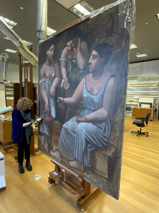 Senior Paintings Conservator Anny Aviram treating Three Women at the Spring (The Museum of Modern Art, New York)