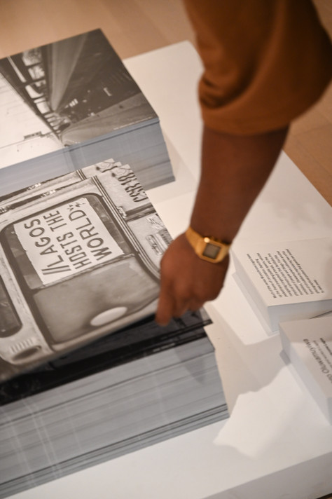 Cory Townes with works by Logo Oluwamuyiwa at MoMA