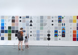 Photo: Jennifer Bartlett. Rhapsody (detail). 1975–76. Enamel on steel, 987 plates. The Museum of Modern Art, New York. Gift of Edward R. Broida. © 2023 Jennifer Bartlett. Photographer: Gus Powell Image description: A family points at lines, shapes, and colors they see in the painting Rhapsody, by Jennifer Bartlett.
