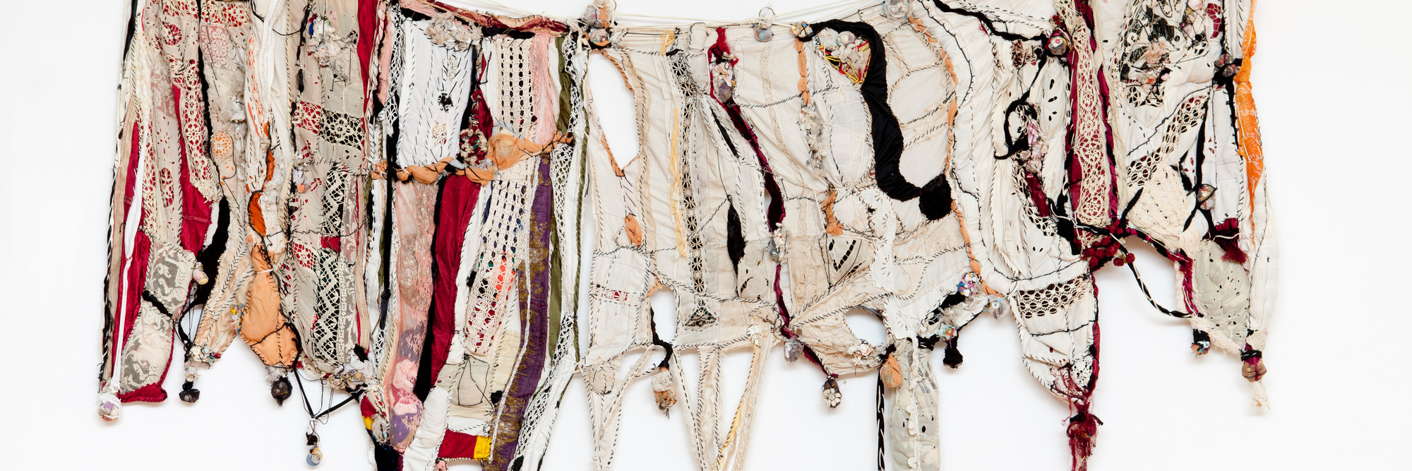 Sonia Gomes. Memory. 2004. Textile, plastic, glass, ceramic, and metal, 58 1/8&#34; × 8&#39; 10 1/4&#34; (147.6 × 270 cm). The Museum of Modern Art, New York. Gift of Christie Zhou and purchase. ©️ 2023 Sonia Gomes. Courtesy of the artist