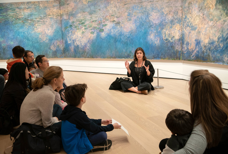 Tours for Fours: Where Are We? Places in Art. Photo: Manuel Martagon Image description: Families talk about nature at a Family Gallery Talk event
