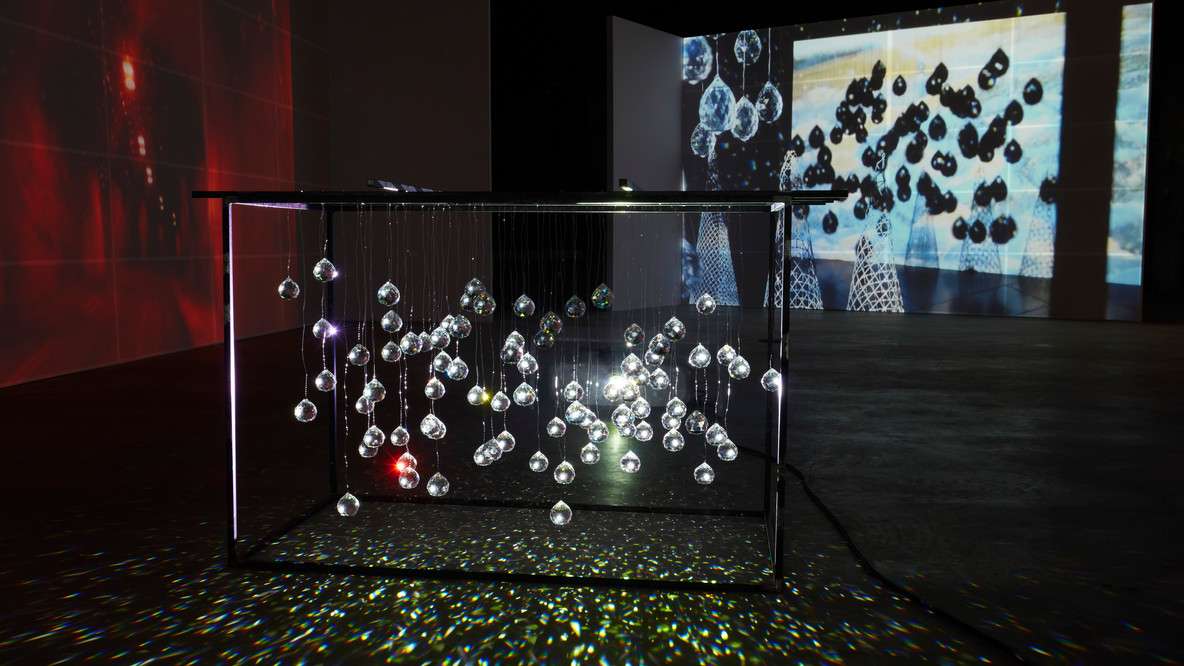 Joan Jonas. Reanimation. 2010/2012/2013. Four videos (color, sound and silent) on custom screens within a prefabricated house structure, two custom benches (made by Ed Gavagan), and crystal sculpture; two wooden theater boxes with video (color, sound and silent); 15 ink drawings on paper; three oil stick drawings on paper, and two china marker wall drawings; varying durations, dimensions variable. Soundtrack and voice: Joan Jonas. Sami yoik singing: Ánde Somby. Piano and additional sound effects: Jason Moran. The Museum of Modern Art, New York. Acquired in part through The Modern Women’s Fund. © 2024 Joan Jonas