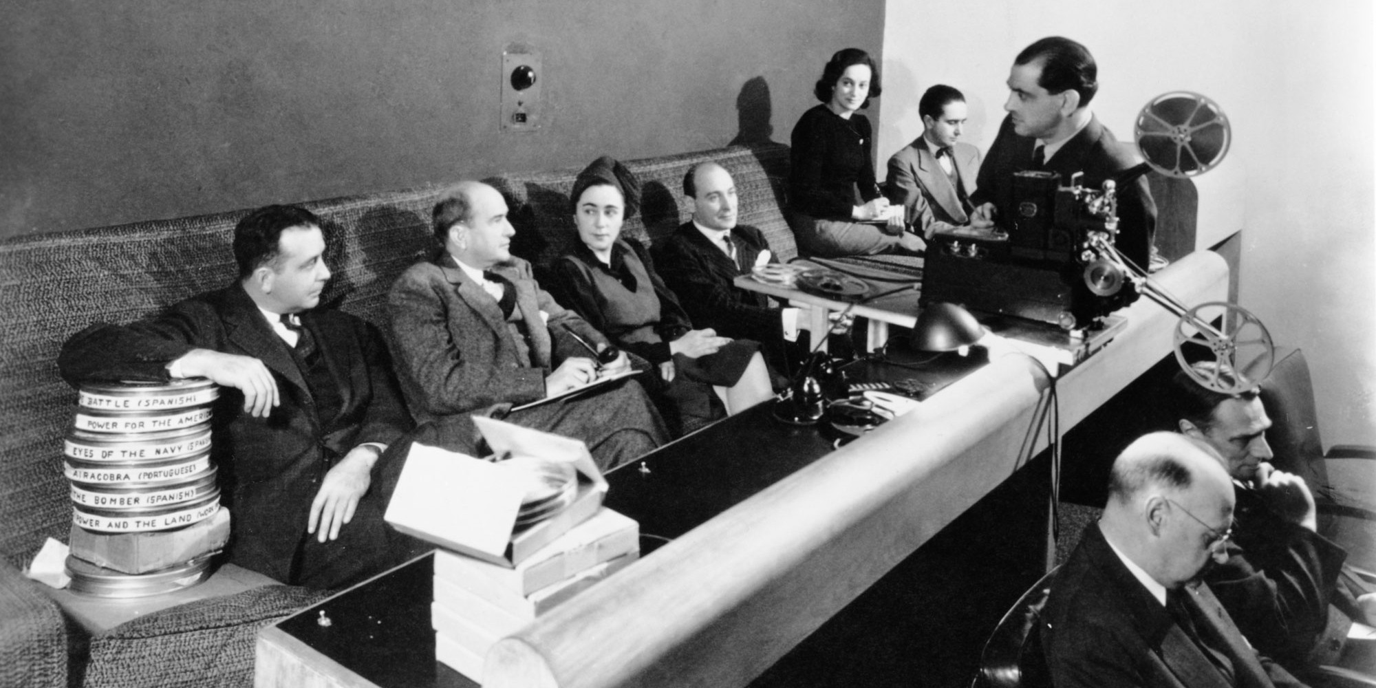 Meeting in MoMA’s projection room, 1942. From left: Ed Kerns, Kenneth Macgowan, Iris Barry, Gustavo Pittaluga, Mercedes Megwinoff, Eduardo Ugarte, Luis Buñuel, Norbet Lust, and Arthur Kross