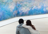 Visitors in the galleries. Shown: Claude Monet. Water Lilies. 1914–26. Oil on canvas, three panels. The Museum of Modern Art, New York. Mrs. Simon Guggenheim Fund. Photo: Gus Powell