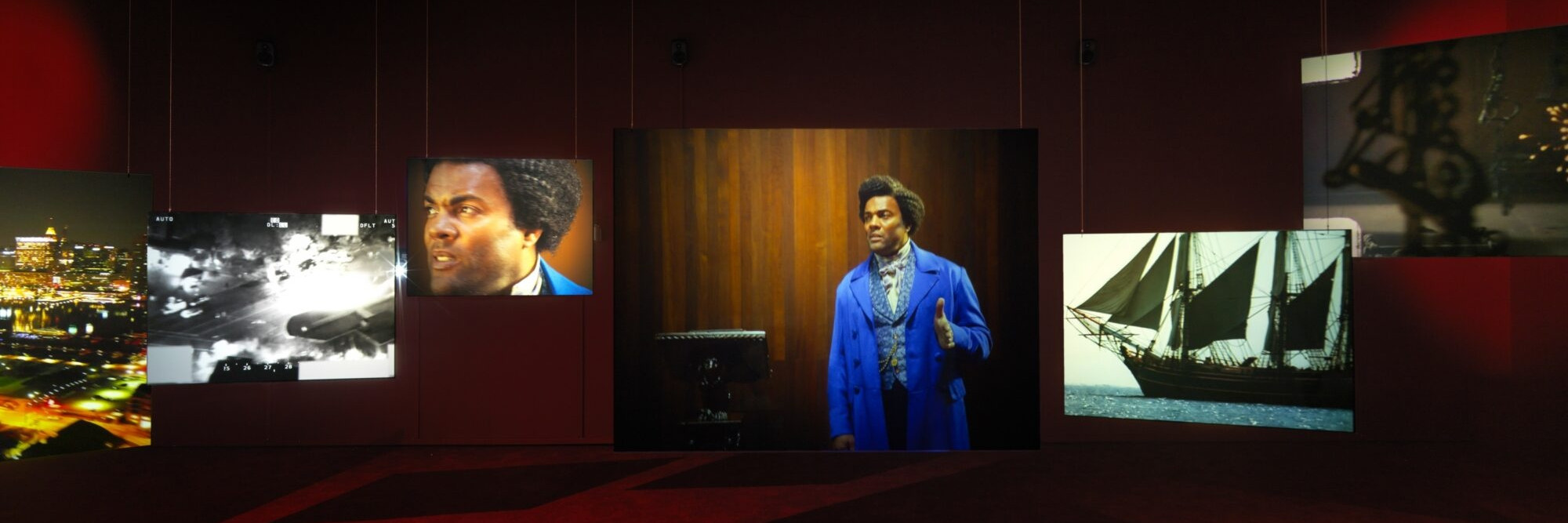 Isaac Julien. Lessons of the Hour. 2019. Ten-channel 4K video and 35mm film transferred to high-definition video (color, sound; 28:46 min.) and 10 projection screens, dimensions variable. The Museum of Modern Art, New York. Acquired through the generosity of the Ford Foundation. © 2024 Isaac Julien. Installation view, Metro Pictures, New York, 2019