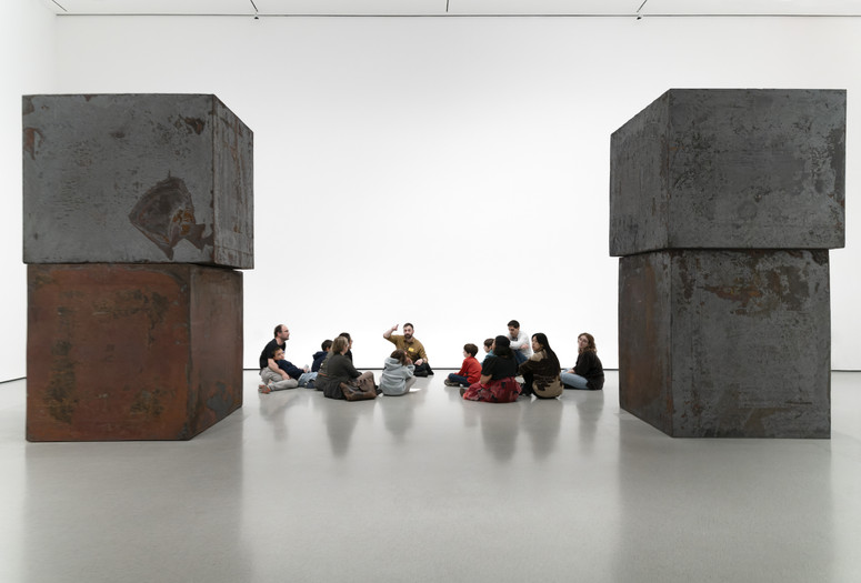 Photo: Martin Seck Image description: Families look at Equal, by Richard Serra, during a Family Galley Talk