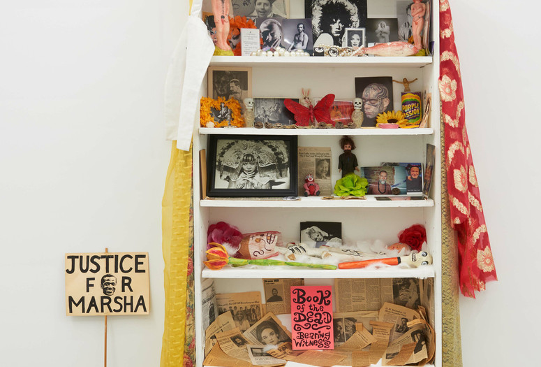 Agosto Machado. Shrine (White). 2022. Mixed-media installation, with jewelry, pins, and textiles; plastic, metal, glass, and papier-mâché objects; photographs, postcards, paper mask, protest sign, memorial-service cards and programs and newspaper and magazine clippings; and original artworks by Scott Covert, Ken Angel Davis with CAConrad, and Gene Fedorko with Stephen Tashjian (Tabboo!), 91 1/2 × 36 × 10&#34; (232.4 × 91.4 × 25.4 cm). The Museum of Modern Art, New York. Acquired through the generosity of Scott Lorinsky. © 2024 Agosto Machado. Courtesy of the artist