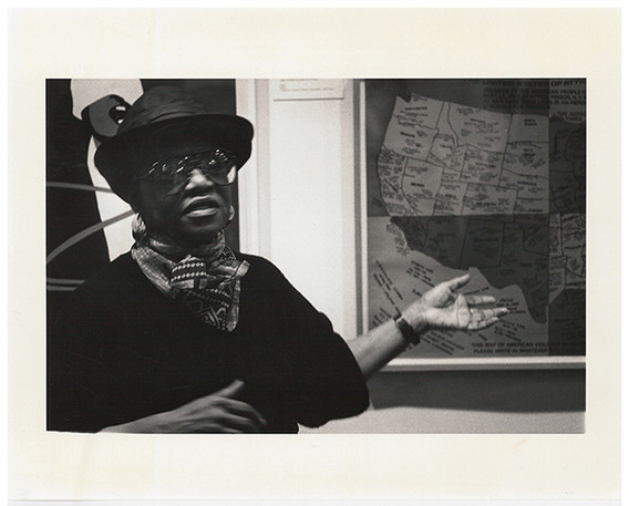 Artist Faith Ringgold speaking in front of her work United States of Attica (1972) for the Gallery Talks by Artists series, which formed part of the weeklong Contemporary Art in Context program, March 4, 1988