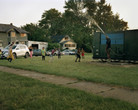 LaToya Ruby Frazier. Shea Cobb, Amber Hasan, and Her Children, Nieces, and Nephews (Zari, DJ, Jayda, Justin, Justace, Jaylen) and Their Friends Playing in the Water Moses West Is Spraying from His Atmospheric Water Generator on North Saginaw Street Between East Marengo Avenue and East Pulaski Avenue on July 29, 2019, Flint, Michigan, from Flint is Family in Three Acts, 2019. © 2024 LaToya Ruby Frazier. Courtesy of the artist and Gladstone Gallery