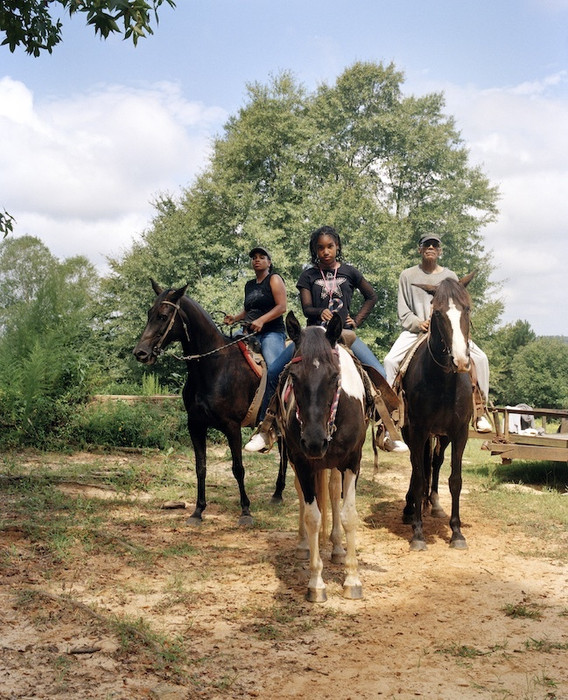 LaToya Ruby Frazier. Zion, Her Mother Shea, and Her Grandfather Mr. Smiley Riding on Their Tennessee Walking Horses, Mares, P.T. (P.T.’s Miss One Of A Kind), Dolly (Secretly), and Blue (Blue’s Royal Threat), Newton, Mississippi from Flint Is Family in Three Acts. 2017–19