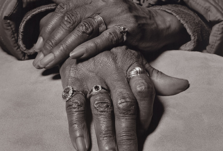 LaToya Ruby Frazier. Marilyn Moore, UAW Local 1112, Women’s Committee and Retiree Executive Board, with her General Motors company retirement gold ring on her index finger, (Youngstown Sheet &amp; Tube Co., Lear Seating Corp., 32 years in at GM Lordstown Complex, assembly plant, van plant, metal fab, trim shop), Youngstown, OH, 2019 from The Last Cruze. 2019. Gelatin silver print, 70 × 57" (177.8 × 144.8 cm). The Museum of Modern Art, New York. Acquired with the generous support of the Fund for the Twenty-First Century; Vital Projects Fund, Robert B. Menschel; Jon Stryker and Slobodan Randjelović; Clarissa A. Bronfman; Ian Cook; David Dechman and Michel Mercure; Thomas and Susan Dunn; Kristy and Robert Harteveldt; Mark Levine; Heidi and Richard Rieger; Christine A. Symchych and James P. McNulty, and Clark B. Winter Jr. © 2024 LaToya Ruby Frazier