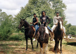 LaToya Ruby Frazier. Zion, Her Mother Shea, and Her Grandfather Mr. Smiley Riding on Their Tennessee Walking Horses, Mares, P.T. (P.T.’s Miss One Of A Kind), Dolly (Secretly), and Blue (Blue’s Royal Threat), Newton, Mississippi from Flint Is Family in Three Acts, 2017–2019. ©️ 2024 LaToya Ruby Frazier. Courtesy of the artist and Gladstone gallery