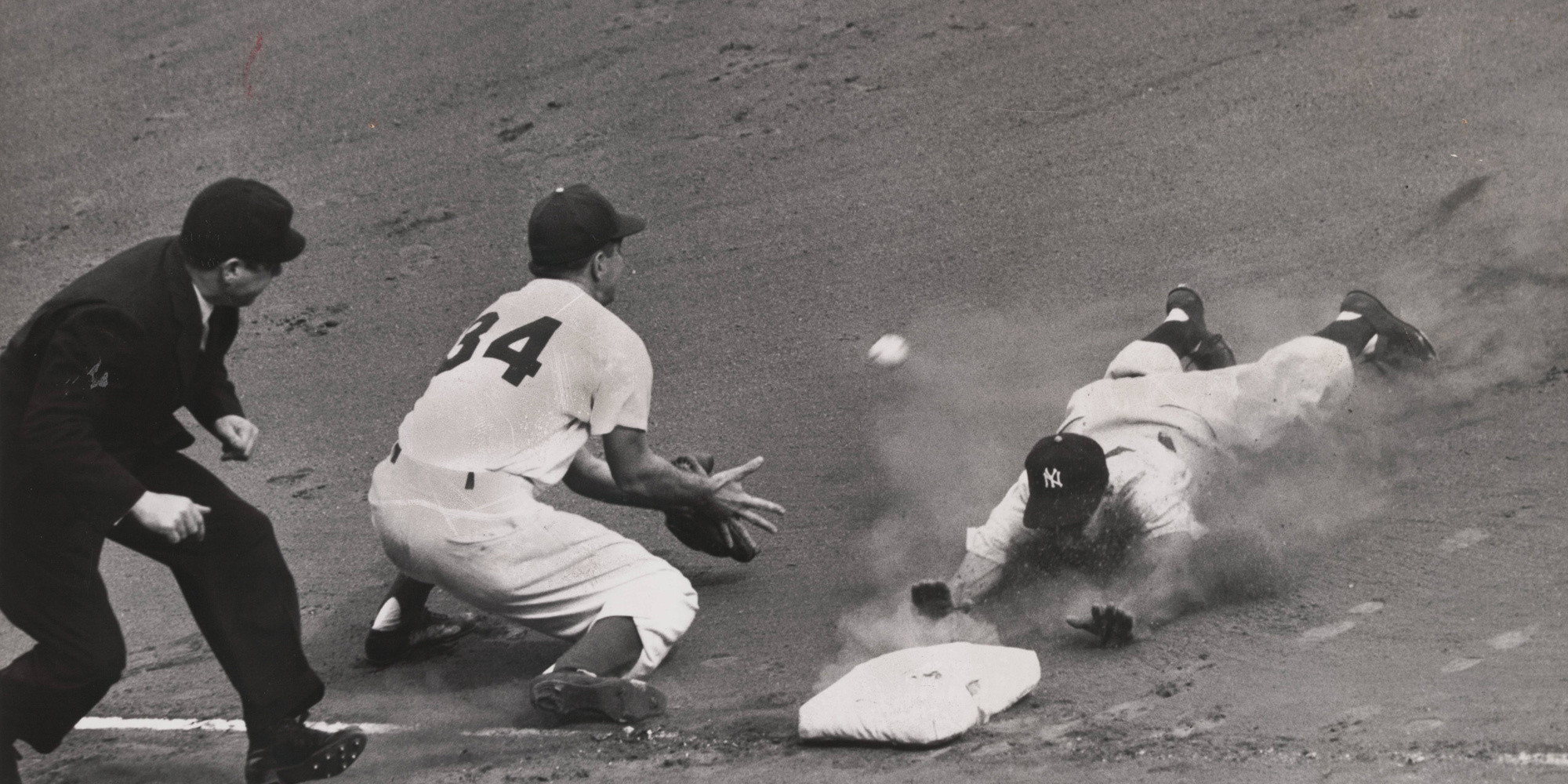 Pat Burns/The New York Times. World Series: Yankees vs. Dodgers (Rizzuto slides into third). October 8, 1949. Gelatin silver print, 6 3/4 × 8 1/2" (17.2 × 21.6 cm). The Museum of Modern Art, New York. The New York Times Collection. © 2024 The New York Times