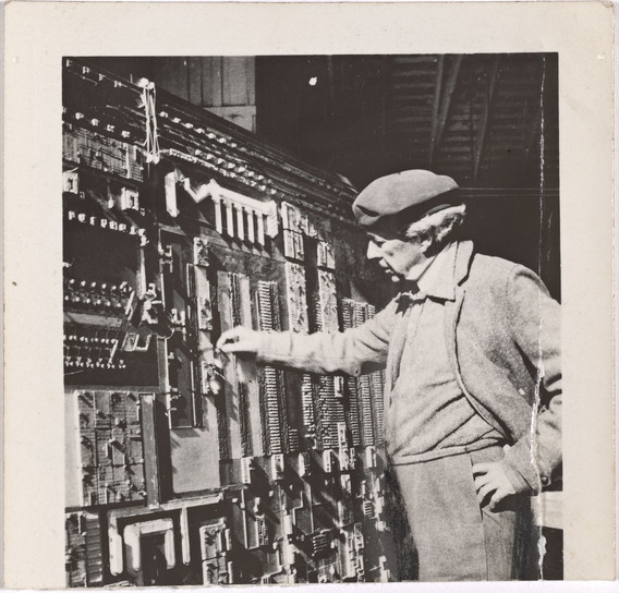 Frank Lloyd Wright inspecting the Broadacre City relief model, 1935. Avery Archival Collection