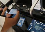 Photo: Jessi BrownImage description: Workshop participants make cyanotypes.