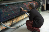 Otobong Nkanga with textile in progress for Otobong Nkanga: Cadence. Courtesy of the artist © Otobong Nkanga. Photo: Wim van Dongen