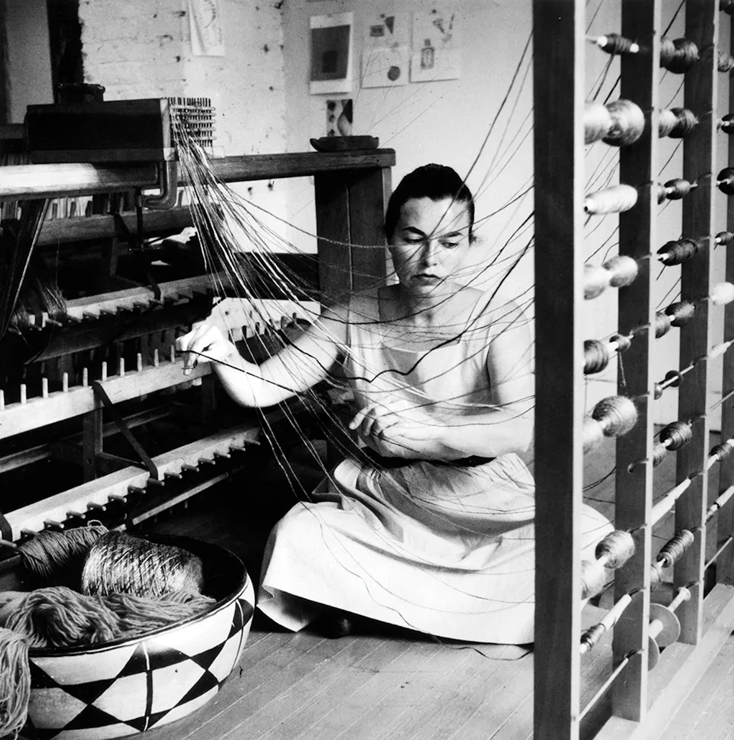 Lenore Tawney in her Coenties Slip studio, New York, 1958. The Museum of Modern Art, New York. © Lenore Tawney. Photo David Attie/Courtesy Lenore G. Tawney Foundation, New York.