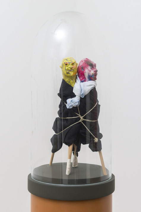 United Enemies. 1994. Two figures of modeling clay, fabric, string, and wood on plastic pedestal with glass bell jar