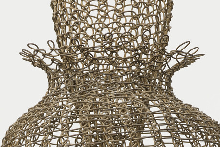 Ruth Asawa. Untitled (S.398, Hanging Eight-Lobed, Four-Part, Discontinuous Surface Form within a Form with Spheres in the Seventh and Eighth Lobes) (detail). c. 1955. Brass wire, iron wire, and galvanized iron wire, 8&#39; 8 1/2&#34; × 14 1/2 × 14 1/2&#34; (265.4 × 36.8 × 36.8 cm). The Museum of Modern Art, New York. Promised gift of Alice and Tom Tisch, 2016. © 2024 Ruth Asawa Lanier, Inc./Artists Rights Society (ARS), New York. Courtesy David Zwirner
