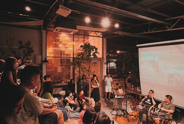 COEX@Kilang Besi, audience sitting atop chengal timber reclaimed from a different malay vernacular house