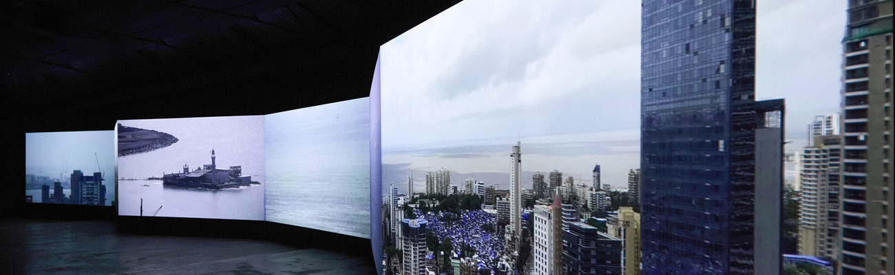 CAMP. Bombay Tilts Down. 2022. Loop, 6+1 screen environment from single-point CCTV video, 13 min. Installation view, Sassoon Docks, Mumbai, 2024. Image courtesy the artists
