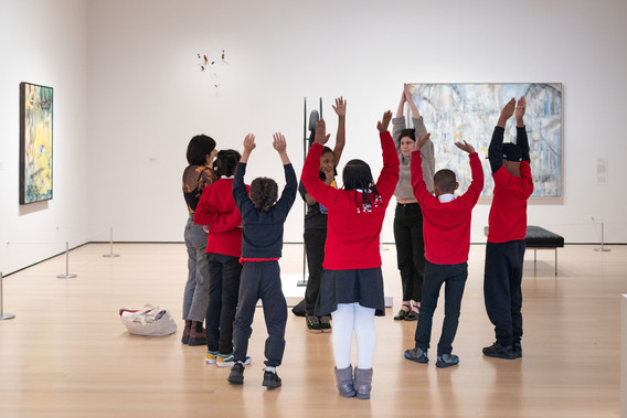 Students engaging with movement and improvisation in the galleries