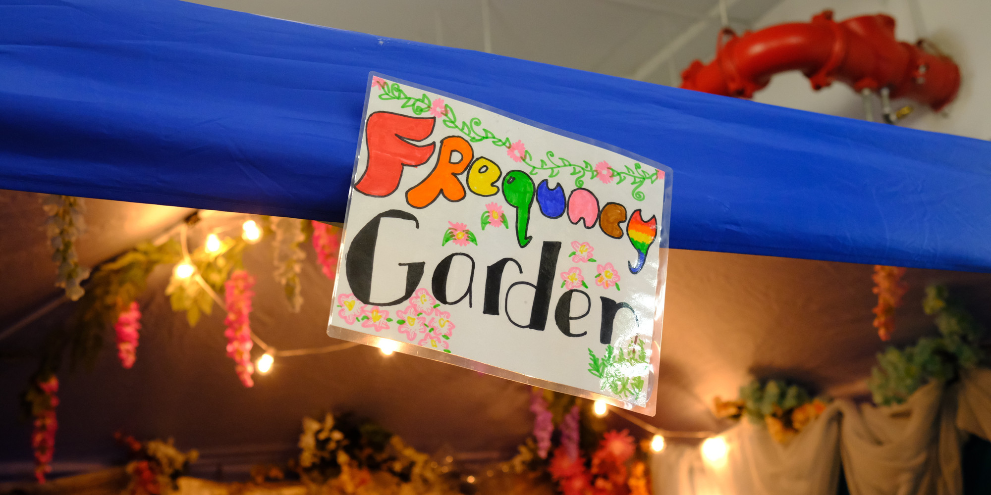 Photo of the Frequency Gardens sign. Photo: Destiny Mata. Digital image © 2025 The Museum of Modern Art