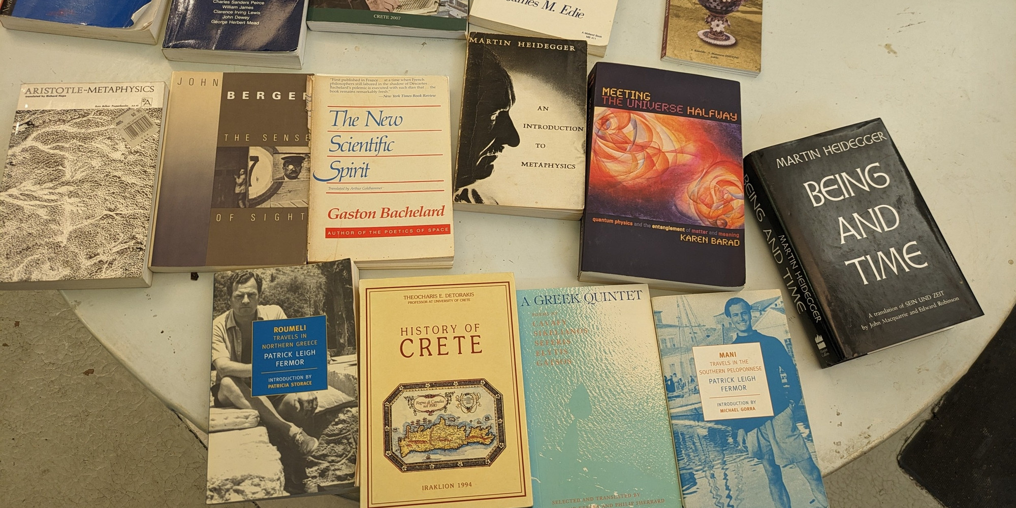 A few of Jack Whitten’s books laid flat on a table in his studio in Queens, New York, 2024