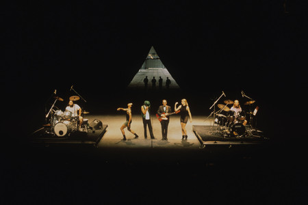 Mike Kelley, Anita Pace, Stephen Prina. Beat of the Traps. 1992. Performed in Expanded Art, Wiener Festwochen, The Remise, Vienna, Austria, 1992. Performers (from left): Jonathan “Butch” Norton, Carl Burkley, Alan Abelew, Stephen Prina, Anita Pace, M.B. Gordy. Photo: Karl Krauss. © Mike Kelley Foundation for the Arts. All Rights Reserved/VAGA at ARS, NY.⁠, Anita Pace, Stephen Prina