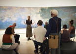 A gallery talk in front of Claude Monet’s Water Lilies. 1914–26. Oil on canvas, three panels. The Museum of Modern Art, New York. Mrs. Simon Guggenheim Fund. Photo: Jason Lindberg. Digital image © 2015 The Museum of Modern Art, New York