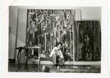 Wifredo Lam with, left, La jungla (The Jungle, 1942–43), right, La mañana verde (The Green Morning, 1943), and on the floor, La silla (The Chair, 1943), in his Havana studio, 1943. Archives SDO Wifredo Lam, Paris