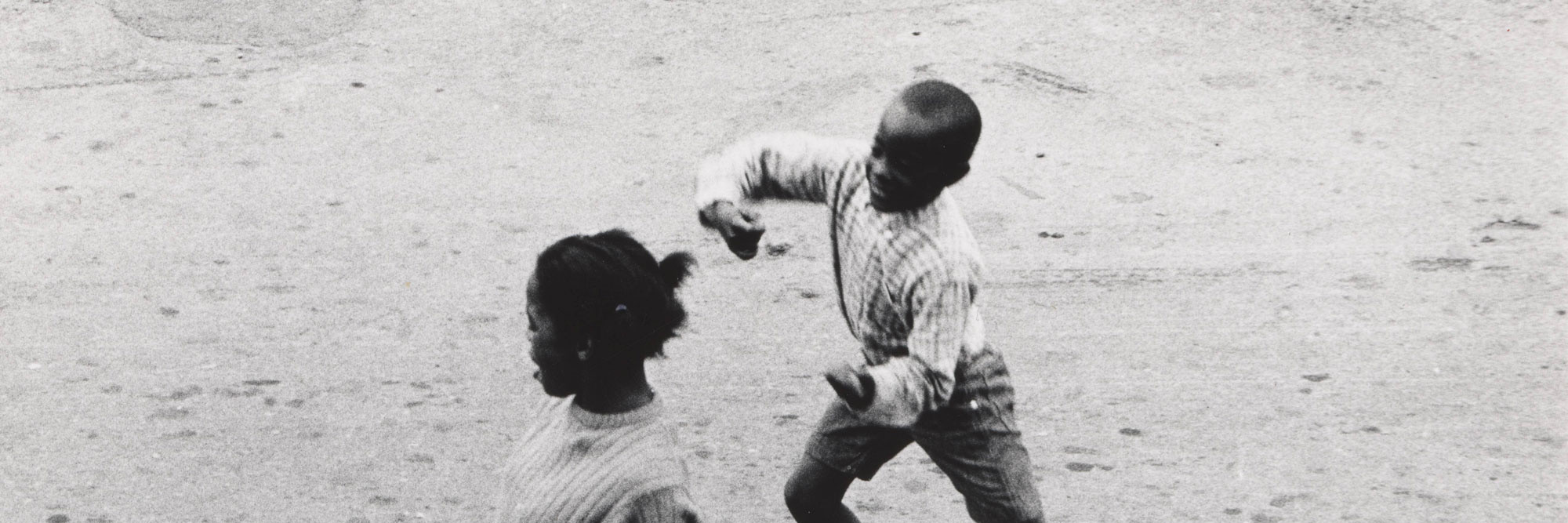 Joanne Leonard. Dancing Seen from Joanne’s Second Story, West Oakland, CA. c. 1967. Gelatin silver print, 5 1/16 × 6 1/16" (12.9 × 15.4 cm). Gift of the artist in honor of Julia Marjorie Leonard and in memory of P. Alfred and Marjorie R. Leonard. © 2026 Joanne Leonard
