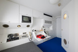 Kisho Kurokawa, Architect &amp; Associates (Tokyo, est. 1962). Capsule A1305 from the Nakagin Capsule Tower. 1970–72; restored 2022–23. Steel, wood, paint, plastics, cloth, polyurethane, glass, ceramic, and electronics.The Museum of Modern Art, New York. Gift of Jo Carole and Ronald S. Lauder, Alice and Tom Tisch, and the Nakagin Capsule Tower Preservation and Restoration Project, Tokyo