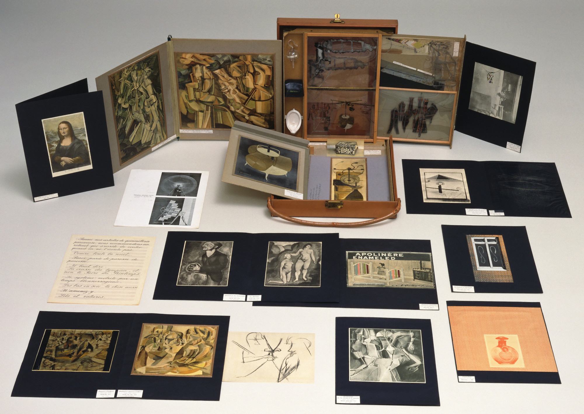 Marcel Duchamp. *Box in a Valise (From or by Marcel Duchamp or Rrose Sélavy)*. 1935–41. Leather valise containing miniature replicas, photographs, color reproductions of works by Duchamp, and one "original" drawing [Large Glass, collotype on celluloid, 7 1/2 x 9 1/2" (19 x 23.5 cm)], 16 x 15 x 4" (40.7 x 38.1 x 10.2 cm). The Museum of Modern Art, New York. James Thrall Soby Fund