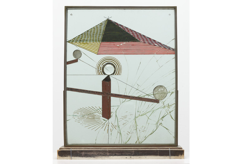 Marcel Duchamp. To Be Looked at (from the Other Side of the Glass) with One Eye, Close to, for Almost an Hour. Buenos Aires, 1918. Oil, silver leaf, lead wire, and magnifying lens on glass (cracked), mounted between panes of glass in a standing metal frame on painted wood base. The Museum of Modern Art, New York. Katherine S. Dreier Bequest. © 2026 Artists Rights Society (ARS), New York/ADAGP, Paris/Estate of Marcel Duchamp