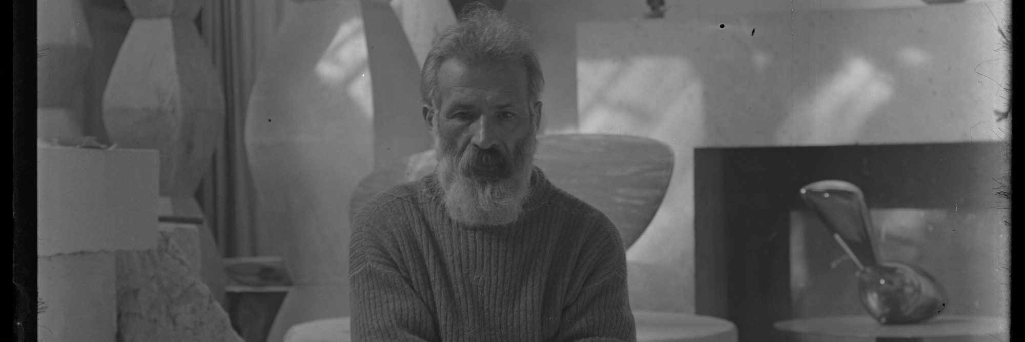 Constantin Brancusi. Self-portrait in the studio with Endless Columns I–IV, Fish (1930), Leda (1926). c. 1934. Glass negative, 5 7/8 × 3 15/16" (15 × 10 cm). Centre Pompidou, Paris, Musée national d’art moderne-Centre de création industrielle, Constantin Brancusi Bequest, 1957. PH 854. Digital image © CNAC/MNAM, Dist. RMN-Grand Palais/Art Resource, NY. © Succession Brancusi – All rights reserved (Adagp)