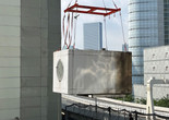 A capsule from the Nakagin Capsule Tower in midair during the building’s dismantling, 2022. Photo: The Nakagin Capsule Tower Restoration and Preservation Project