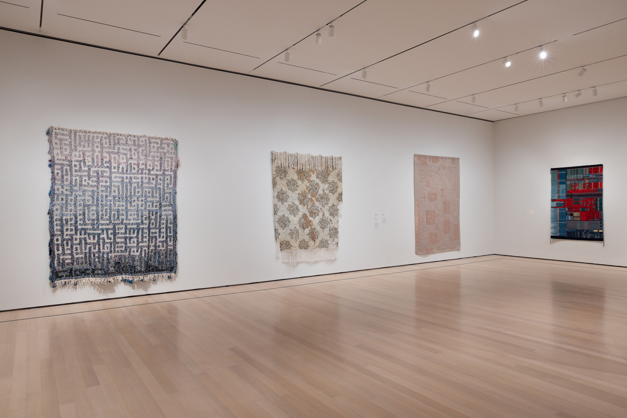 Installation view of the exhibition “Woven Histories: Textiles and
