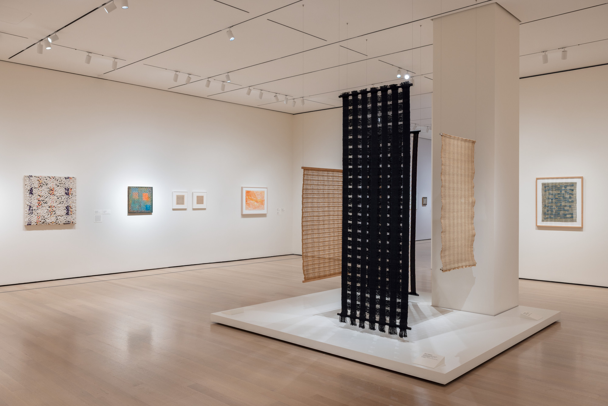 Installation view of the exhibition “Woven Histories: Textiles and