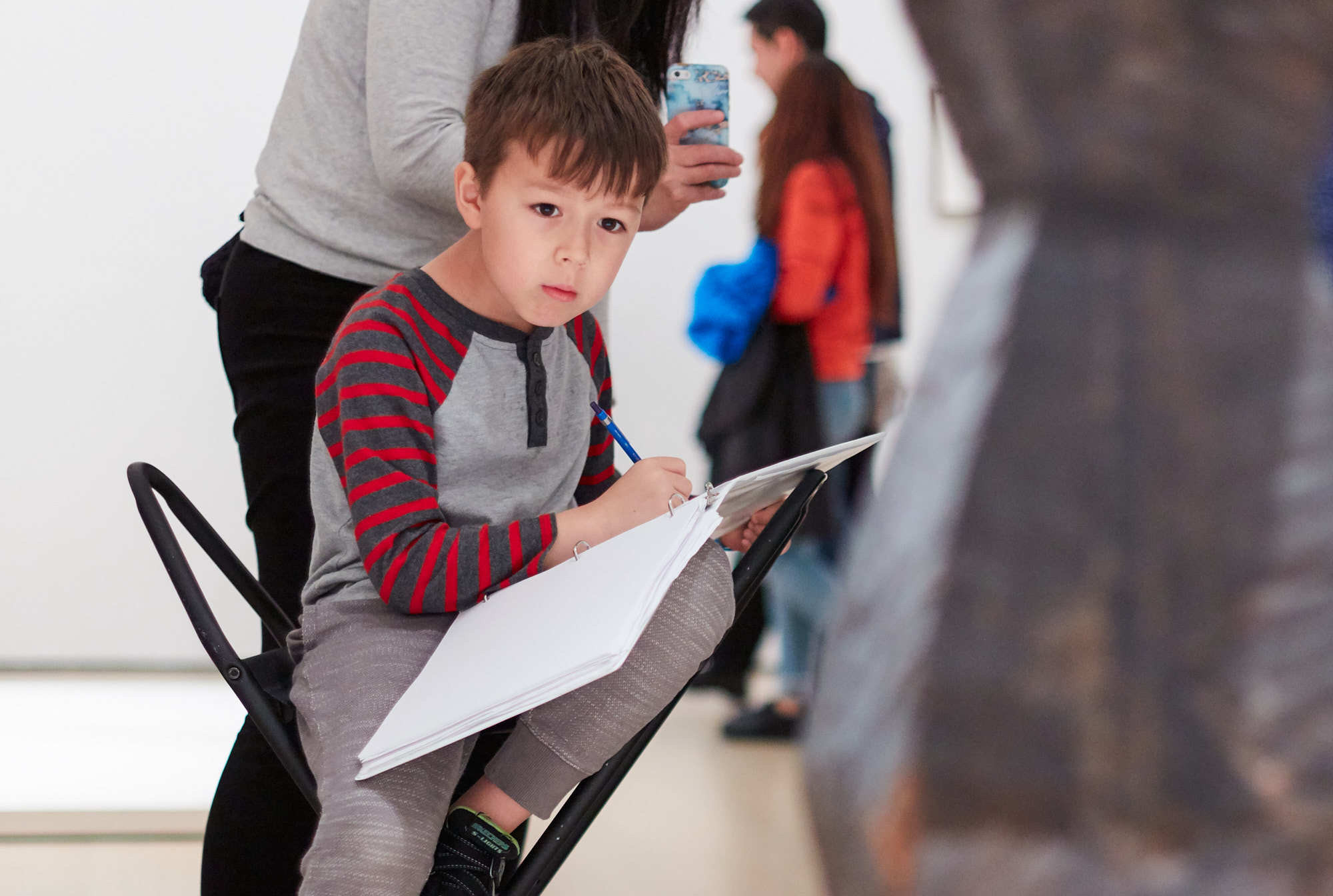 A young visitor sketches in the galleries. Photo: Beatriz Meseguer
