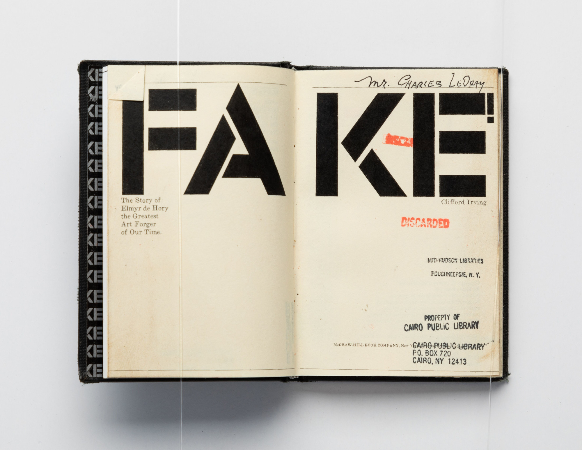 Charles LeDray. FAKE!: The Story of Elmyr de Hory, the Greatest Art Forger of Our Time. (Title page spread). 2020. Unique handmade miniature “used” book made from drawing, mixed-media markings, stains, stamping, and letterpress and offset printing. One of 177 unique examples from LeDray’s Book Ends collection. Varying dimensions: each book in collection is smaller than print, 4 × 5″ Photo credit: Jenny Gorman