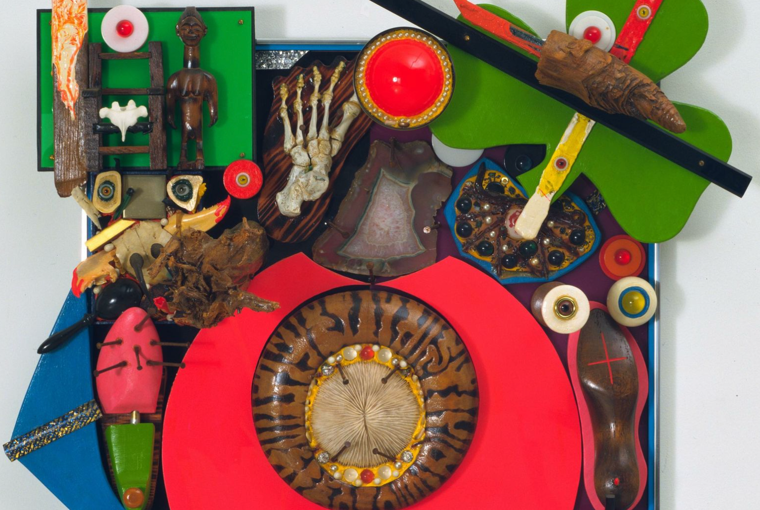 Alfonso Ossorio. Empty Chair or The Last Colonial (detail). 1969. Glass and plastic marbles, West African wood figures, tree fragments, pebbles, geode, iron nails, coral, seashells, wood shoe trees, lobster claws, sword, painted human foot bones and vertebra, faux pearls, plastic and wooden letters, plastic sheets and scraps, wood scraps, painted wood, animal claws and bones, domino, glass eyes, bell, and other materials on plastic sheets mounted on wood. The Museum of Modern Art, New York. Gift of the artist