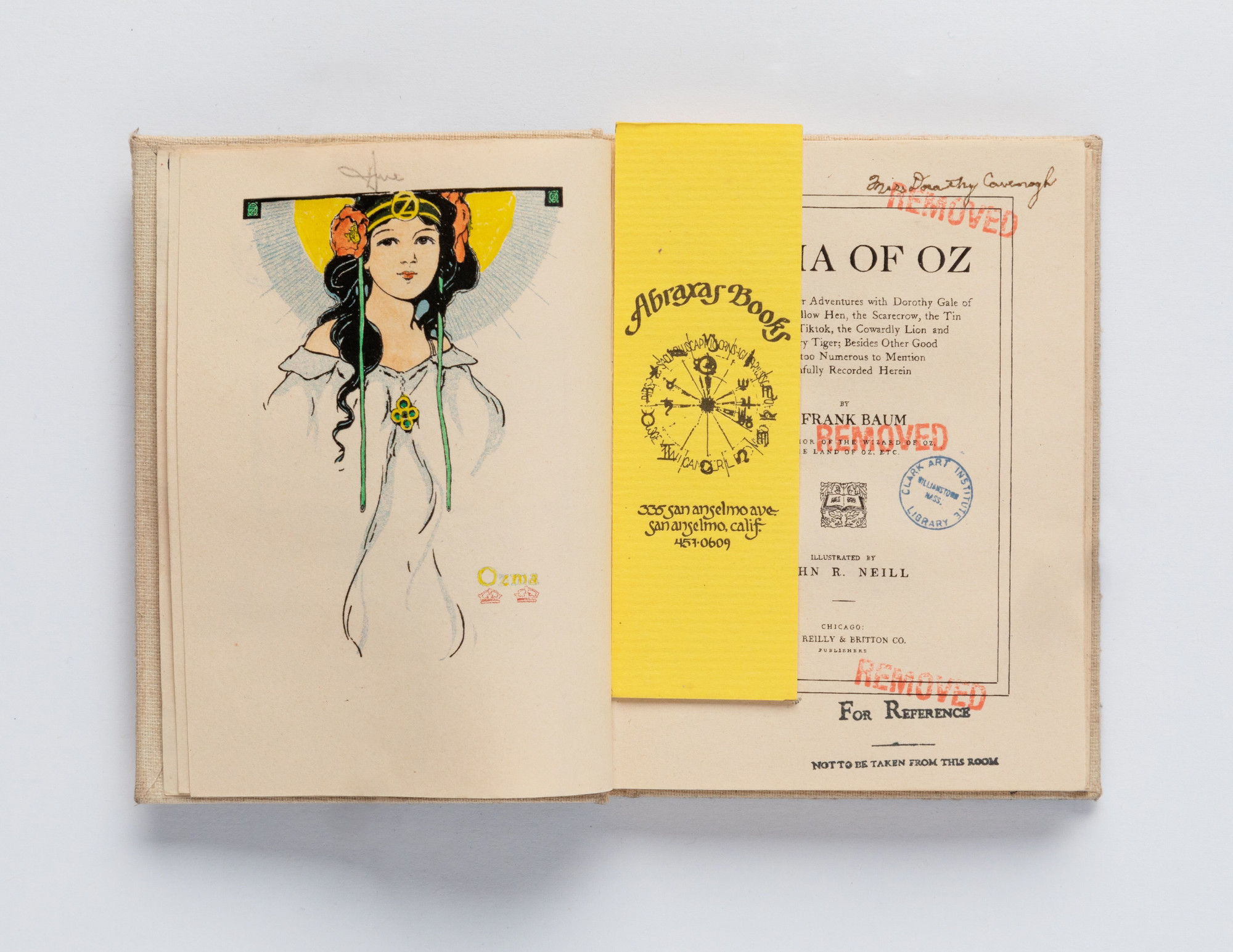 Charles LeDray. Ozma of Oz. (Frontispiece and title page with bookmark.). 2020. Unique handmade miniature “used” book made from drawing, mixed-media markings, stains, stamping, and letterpress and offset printing. One of 177 unique examples from LeDray’s Book Ends collection. Varying dimensions: each book in collection is smaller than print, 4 × 5″ Photo credit: Jenny Gorman