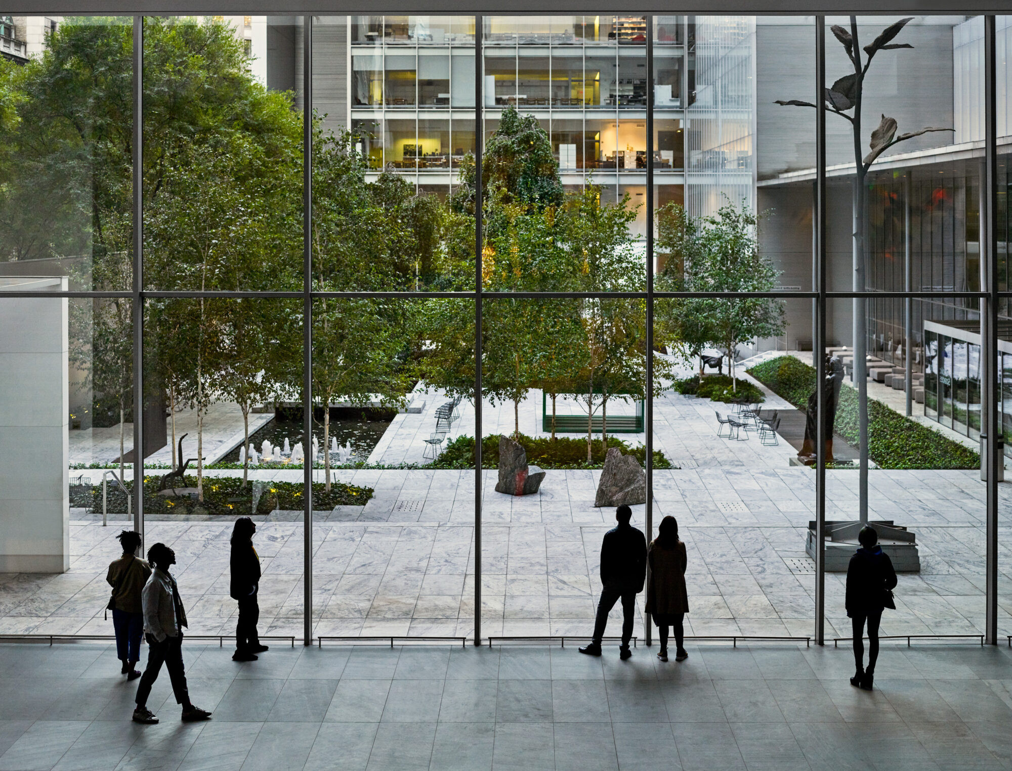 A view from the Agnes Gund Garden Lobby looking out onto the Abby Aldrich Rockefeller Sculpture Garden. © 2023 The Museum of Modern Art, New York. Photo: Noah Kalina